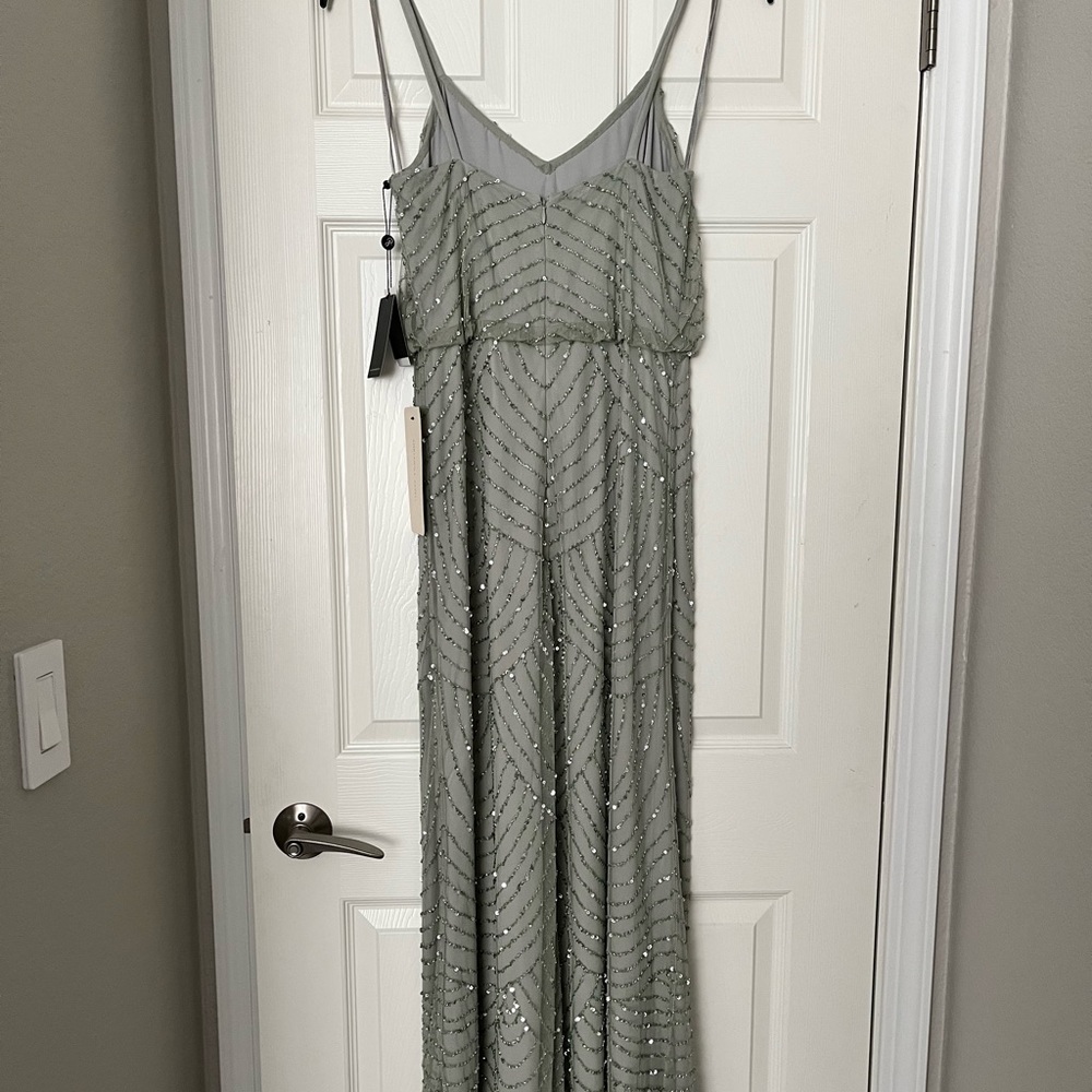 Never worn Adrianna Papell Beaded Gown
Tags attached
Size 6
Color mint - Picture 6 of 7